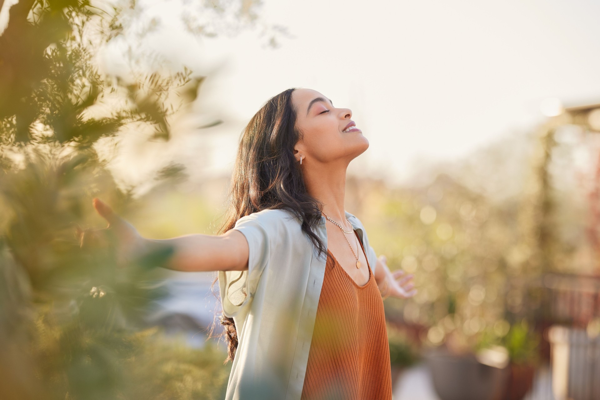 Serene latin woman enjoy sunset with gratitude